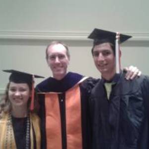 Undergraduate Commencement: Elizabeth Huschke (who is taller, but on a lower step!), Scott Howard, and Lucas DeLaFuente